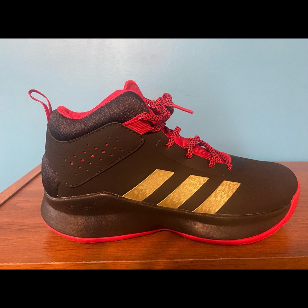 Boys Adidas high top sneaker. Never worn.